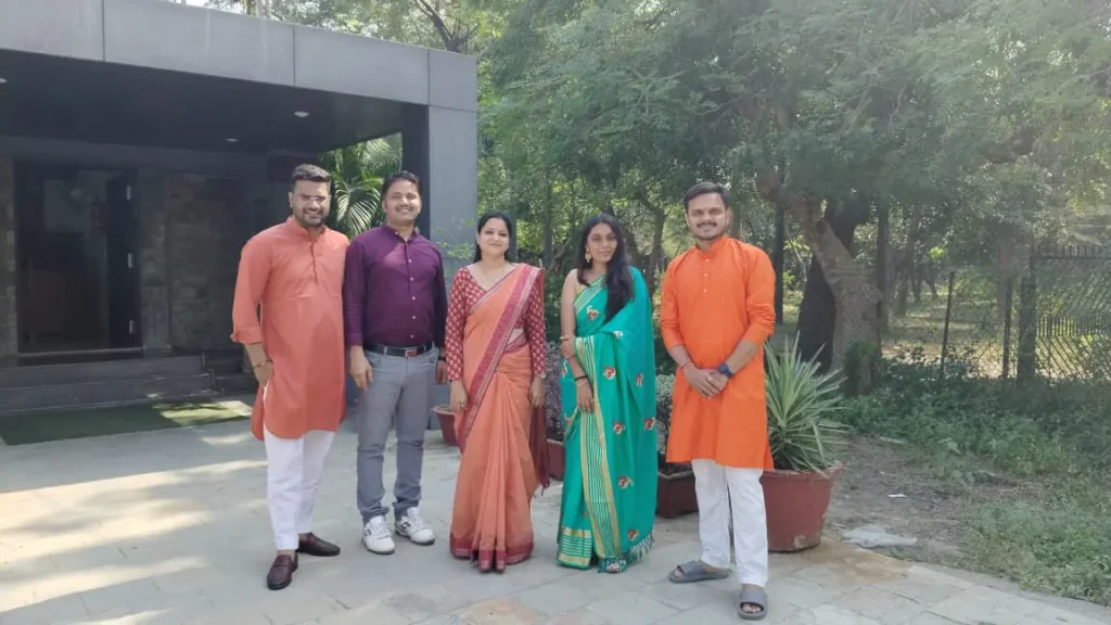 Employees in kurtas and saree, captured at a GIAS festive or annual event.